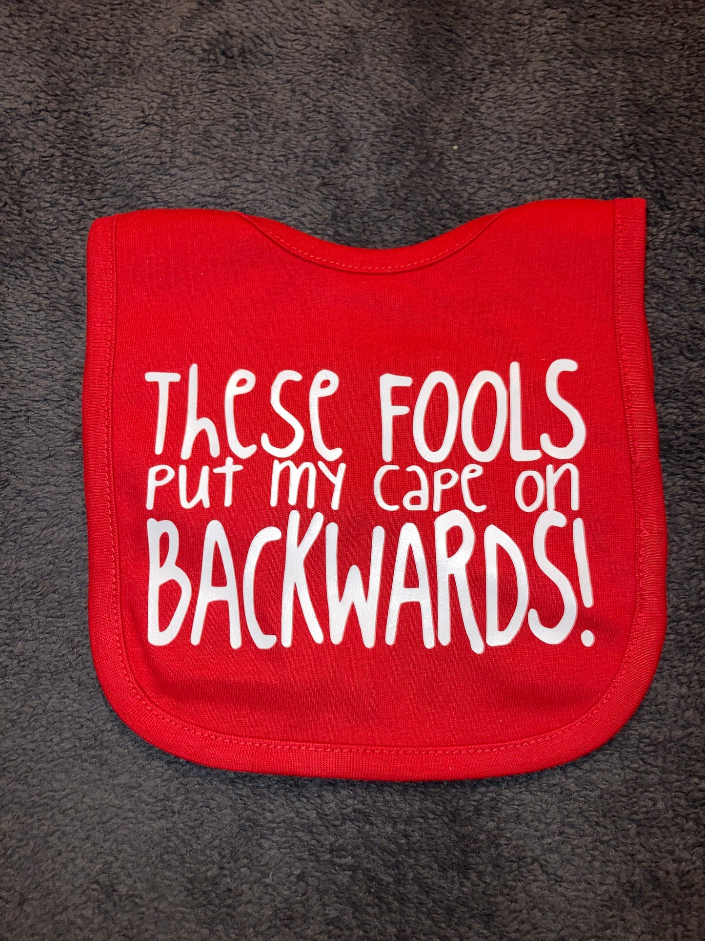 These Fools Put My Cape On Backwards Bib
